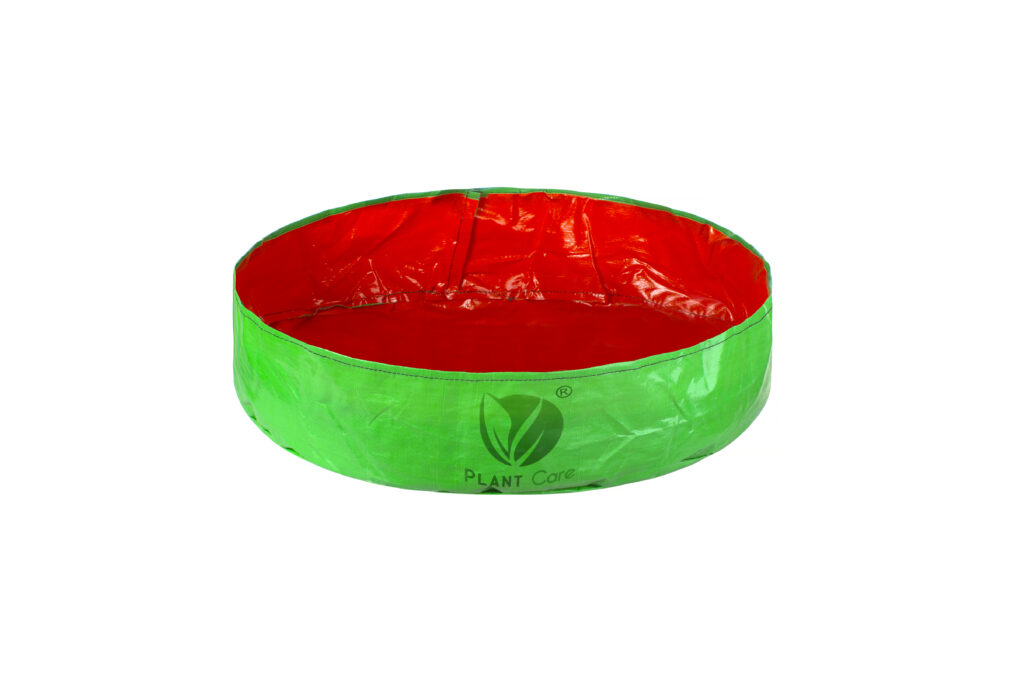 24x6 inch round grow bag with dual color design showing red interior and green exterior from angled perspective